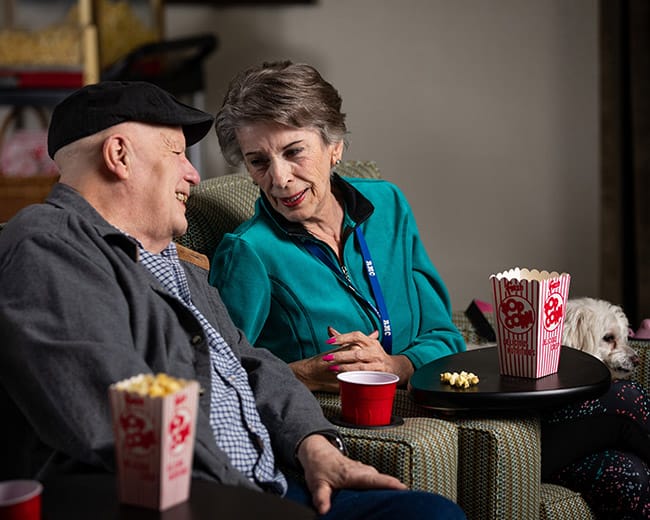 man and woman watching a movie