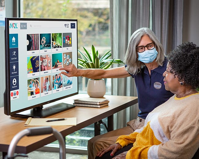 associate working with woman on memory