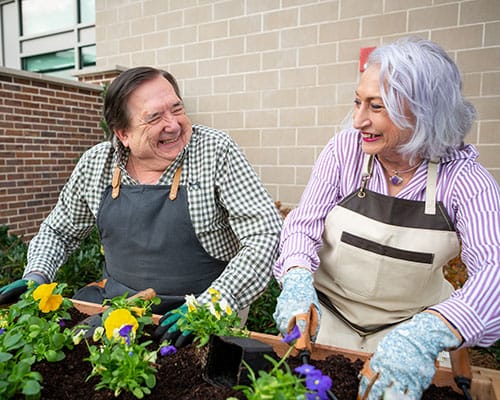 man and woman gardening