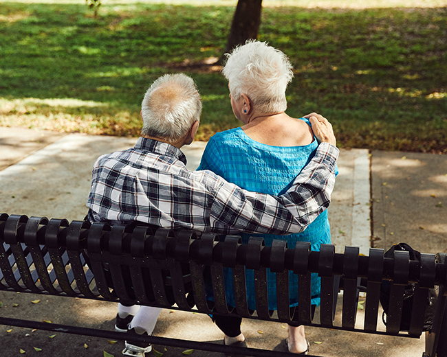 couple sitting with tablet