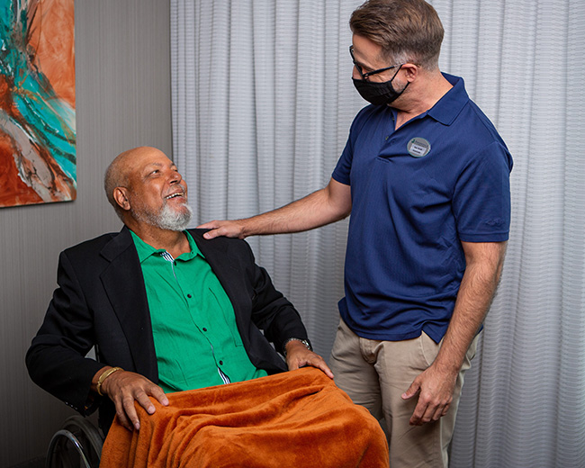 caregiver laughing with man