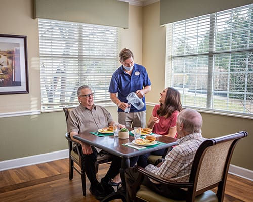 caregiver serving meal