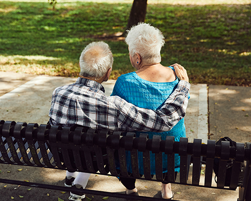 couple sitting on bench outside