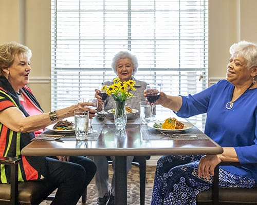 friends sharing meal and wine