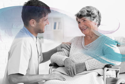 male caregiver with woman in wheelchair