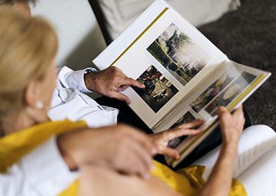 Seniors looking at a photo album