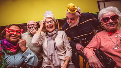Seniors having fun in silly hats