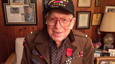 Josiah Benator poses with his medals