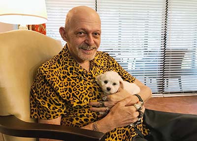 Brookdale senior holding puppy