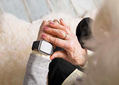 senior wearing a smart watch