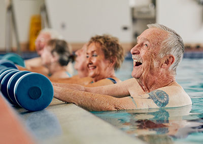 older adults exercising in pool