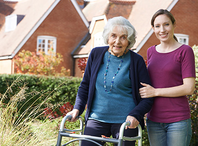 daughter with older mother using walker