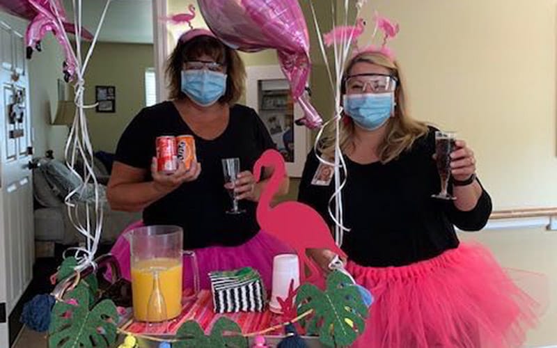  Associates at Brookdale Sandy Springs (Tennessee) share snacks and drinks with residents on a themed cart.