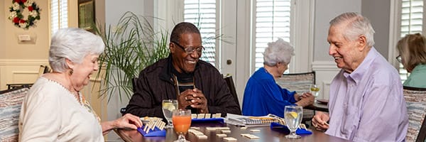 Associate serving breakfast to couple